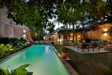 The romantic courtyard and pool at Casa de los Mapas