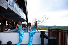 Mermaids in the pool at the launch of RIMBA's UNIQUE Rooftop Bar & Restaurant