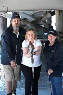 Squid Fest's Jill Barton (centre) with volunteers Brian Tolver-Banks and Teresa Pool from Fishability