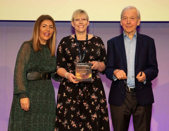 Rachael Jackson, Fred. Olsen Cruise Lines' Public Relations Manager (centre), receives the 'PR Campaign of the Year' award at the inaugural 'TravMedia Awards 2020' from John Humphrys, TV broadcaster / journalist and Louise Napier of TravMedia.     