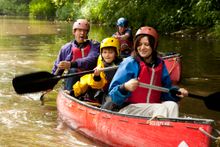 Family kayaking on a YHA Adventure break