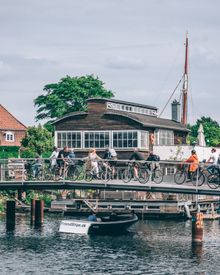 Bikes passing one of the many bridges crossing the water in Copenhagen.