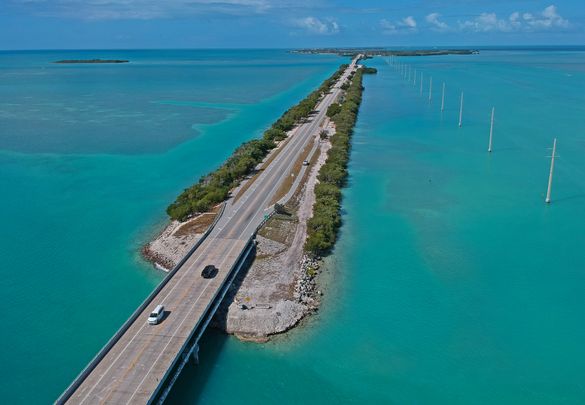 Vehicular traffic on the Florida Keys Overseas Highway is extremely light Tuesday, March 24, 2020, in Islamorada, Fla. The subtropical island destination is temporarily closed to visitors until further notice due to the coronavirus crisis, according to lo