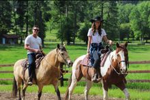 Horseback trail rides are an integral part of the experience at Flathead Lake Lodge. 