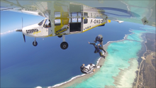 Skydiving over New Caledonia's lagoon 