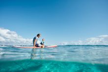 Dad and Son Play in Ocean