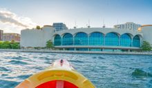 Enjoy an iconic lake adventure by kayaking in front of the Frank Lloyd Wright-designed Monona Terrace.