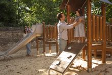 Family in the Adventure Playground at Blenheim Palace's Pleasure Gardens