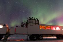 A group of guests on top of Frontiers North's Thanadelthur Lounge observation deck
