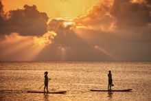 Paddleboarding at sunset