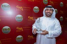 Mubarak Al Nuaimi, Director of Promotions and Overseas Offices, Holding the Award