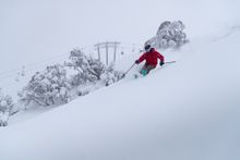 A skier enjoying some powder turns in Thredbo during winter