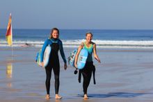 Happy mums after a surf in Cornwall