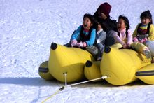 Banana boat rafting is one of several fun activities to try in the snow of the Kannabe Highlands.