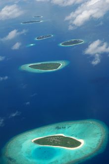 An aerial photo of the Maldives’ naturally distanced islands.