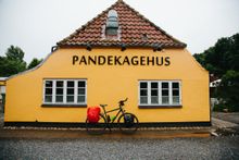 A bike parked in front of a 'pancake house' in South Jutland.