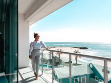Meagan Cox enjoying the view from a Seashells Mandurah apartment.Credit @territory.by.petastenhouse