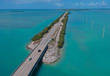 Vehicular traffic on the Florida Keys Overseas Highway is extremely light Tuesday, March 24, 2020, in Islamorada, Fla. The subtropical island destination is temporarily closed to visitors until further notice due to the coronavirus crisis, according to lo