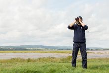 Reserve Warden Scott Petrek near the Severn Estuary at WWT Slimbridge.