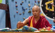 Monk blessing our bespoke Buff scarves in a puja cermony in Kathmandu