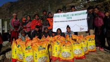 Himalayan trek porters in Everest region receiving rice for Covid hardship
