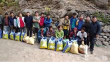 Himalayan trek porters in Kanchenjunga receiving rice for Covid hardship