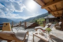 Sunbathing on the terrace at Chalet Chouqui, Verbier