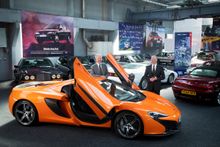 McLaren CEO Mike Flewitt (left) hands over one of his cars - the most modern car in the collection - to Richard Usher.  With all the cars finally revealed, The Great british Car Journey launches in a refurbished warehouse in the old wireworks, Ambergate D