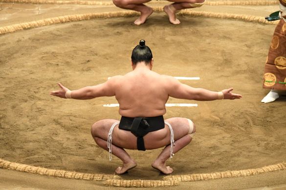 From Shutterstock-Sumo wrestler on the final round day of past Japan Sumo Tournament competition, Tokyo
