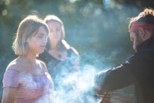 Aboriginal guide Dwayne Bannon-Harrison performing a smoking ceremony during a traditional welcome on a Ngaran Ngaran Culture Awareness tour.