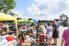 Crowds at last year’s 301 Endless Yard Sale shop along a row of vendor booths. 
