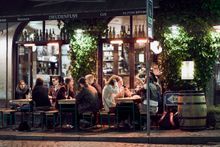 People sitting outside Café Drudenfuss in Aarhus.