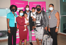 The Canadian Seenauth-Gangaprasad family pose with Jamaican tourism and government representatives upon arrival at Sangster International Airport in Montego Bay on July 4. From left: Nadine Spence, Area Chair of the Jamaica Hotel and Tourist Association; 