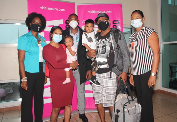 The Canadian Seenauth-Gangaprasad family pose with Jamaican tourism and government representatives upon arrival at Sangster International Airport in Montego Bay on July 4. From left: Nadine Spence, Area Chair of the Jamaica Hotel and Tourist Association; 