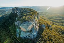 Sun rising over Pantoneys Crown tableland, Capertee Valley in the picturesque Gardens of Stone National Park.