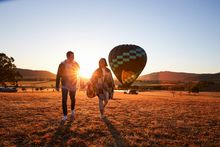 Couple arriving for a sunrise hot air balloon ride in the Hunter Valley.
