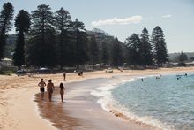Visitors enjoying a day at Avoca Beach on the Central Coast.