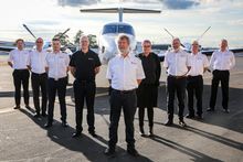 Founder Tony Kirkhope (centre), with the Australian Air Safaris team.