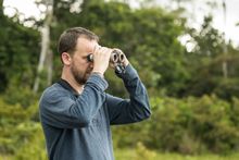 Will Bolsolver using Swarovski Optik binoculars in the Congo