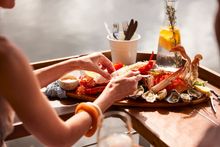 Couple enjoying food and drink at Woy Woy Fishermen's Wharf.