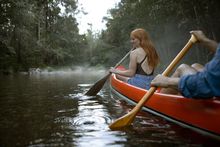 Kayaking on rainforest-lined rivers in Bellingen.