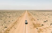 4WD driving along an unsealed road in Mungo National Park, Mungo.