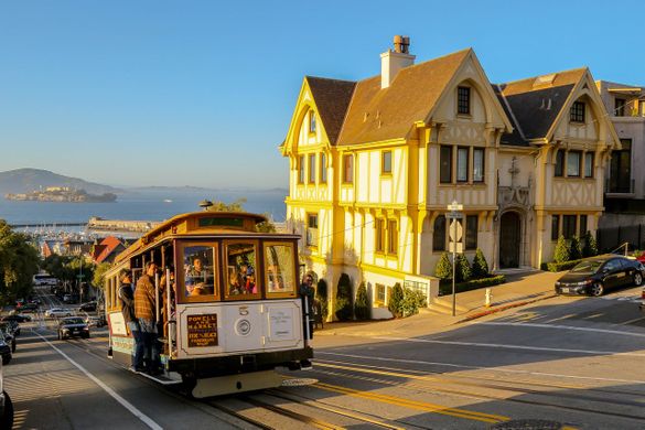 Cable car on Hyde Street with Alcatraz in the background