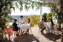 Couple enjoying food and drink at Bistro Molines, Mount View in the Hunter Valley.
