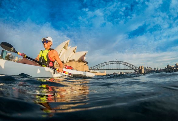 Woman kayaking on Sydney Harbour.