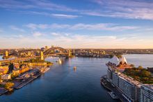 our, Sydney Mandatory credit: Destination NSW Description: Sun rising over Sydney Harbour and Circular Quay, Sydney.