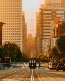 California Street with the Bay Bridge in the background.