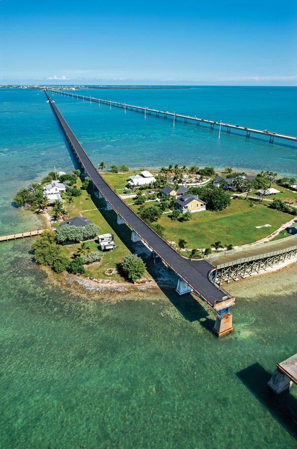 This drone aerial photo shows the Old Seven Mile Bridge ready for its Wednesday, 12 January 2022, reopening to pedestrians, bicyclists, anglers, and visitors to Pigeon Key (island shown in photo). The old bridge originally was part of Henry Flagler’s Flor