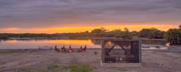 Asilia Usangu Trails Camp — Star Cube Tent, dining at sunset Asilia Usangu Trails Camp — Star Cube Tent, dining at sunset