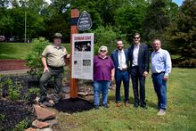 City, state and local tourism officials gather by the Dunbar Cave TN Music Pathways marker.